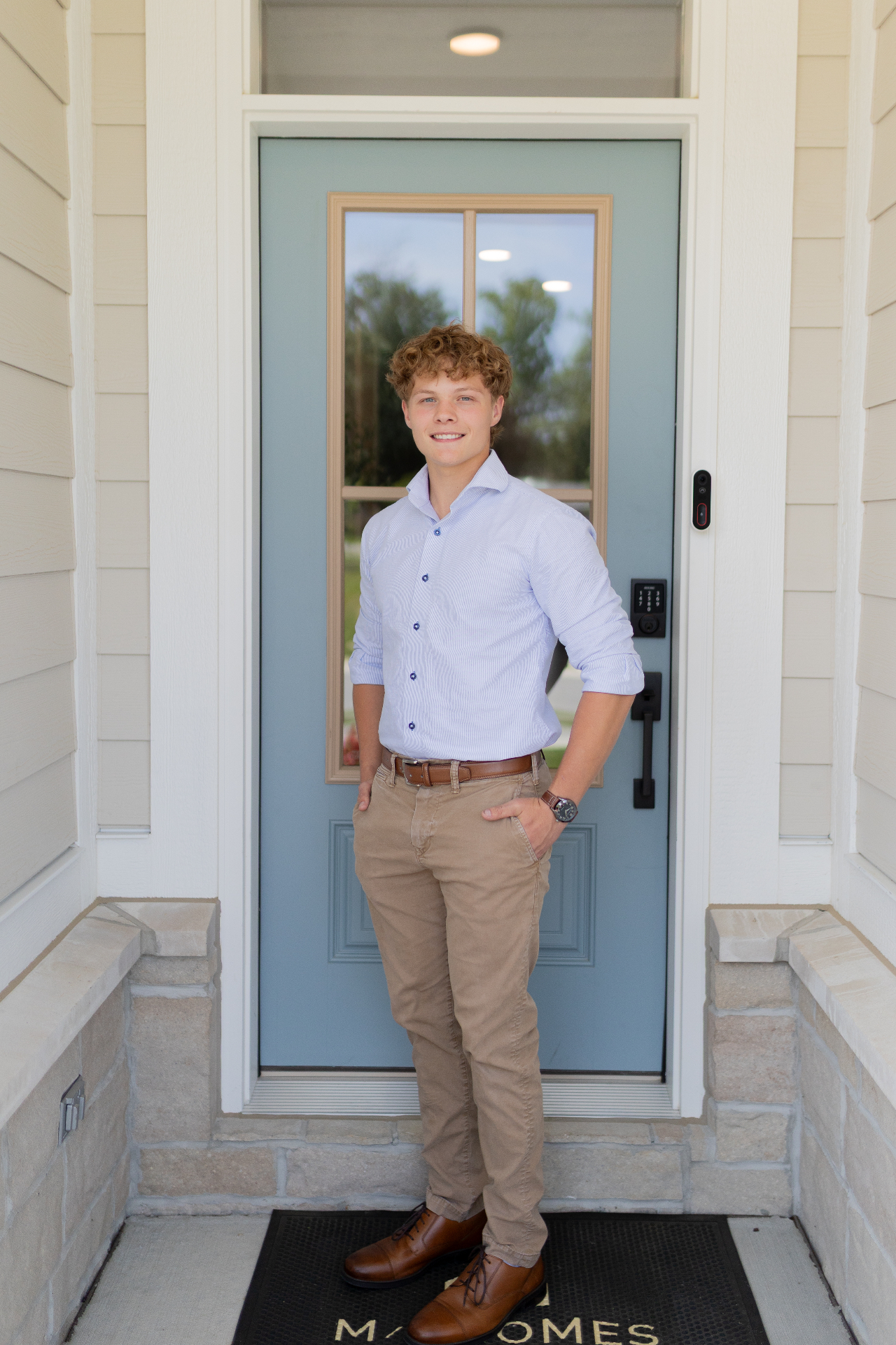 DoorSurge founder, a real estate agent, standing at a home's front door